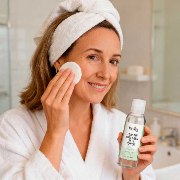 Woman applying skin toner with cotton pad