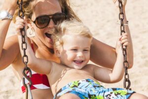 move and baby boy on swing