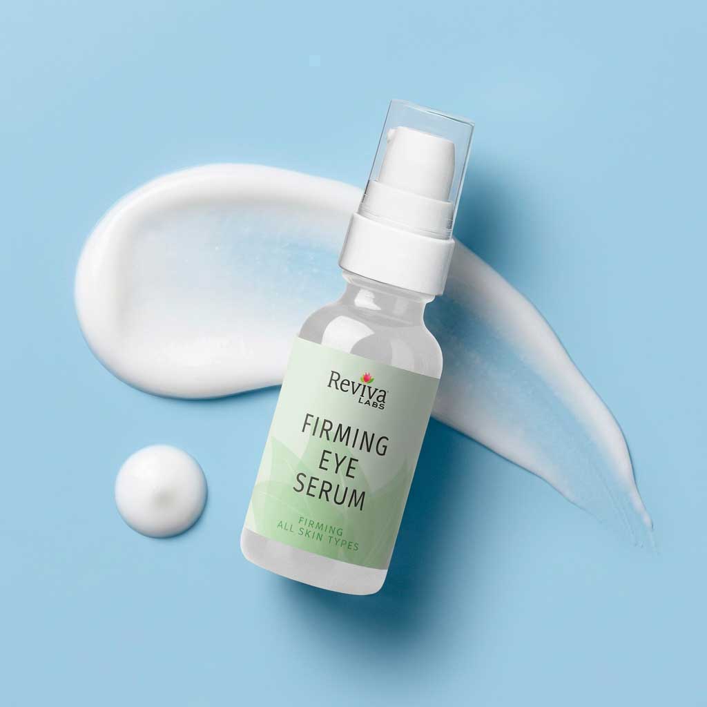 Firming eye serum bottle on light blue background
