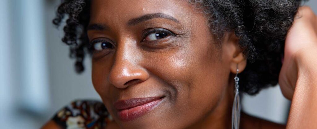 2 black middle age coyly smiling female closeup on 257f6585 ad1b 48af 80bf 9035c1fce090 3