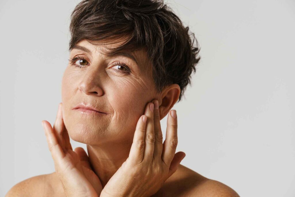 mature half naked woman touching her face and look 2025 02 16 10 30 06 utc