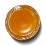 Close-up of amber liquid in jar