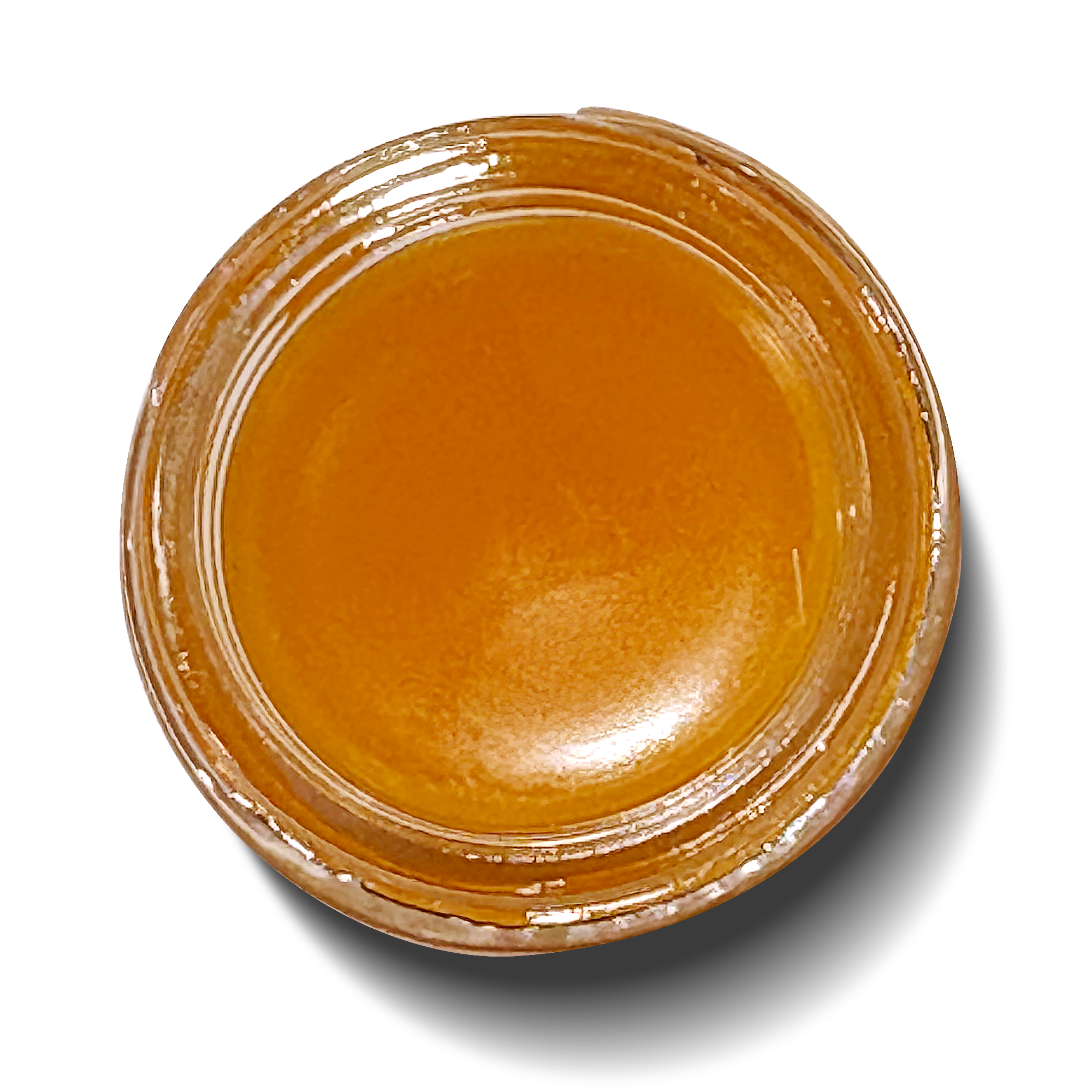 Close-up of amber liquid in jar