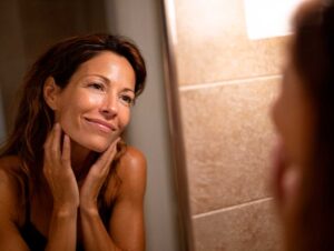 Woman admiring herself in mirror