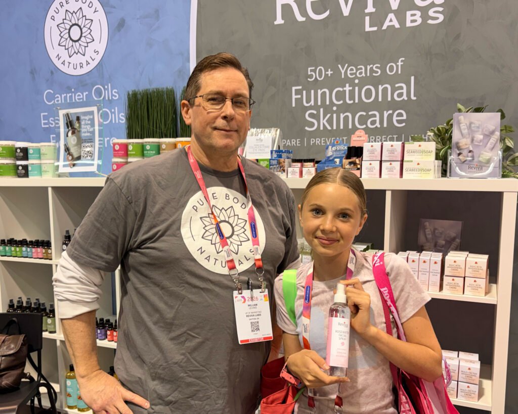 Two people at a skincare trade show.
