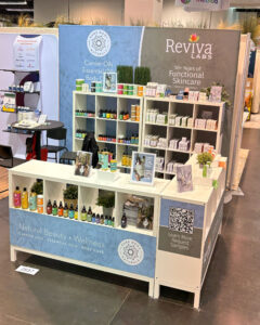Skincare product booth at a trade show.