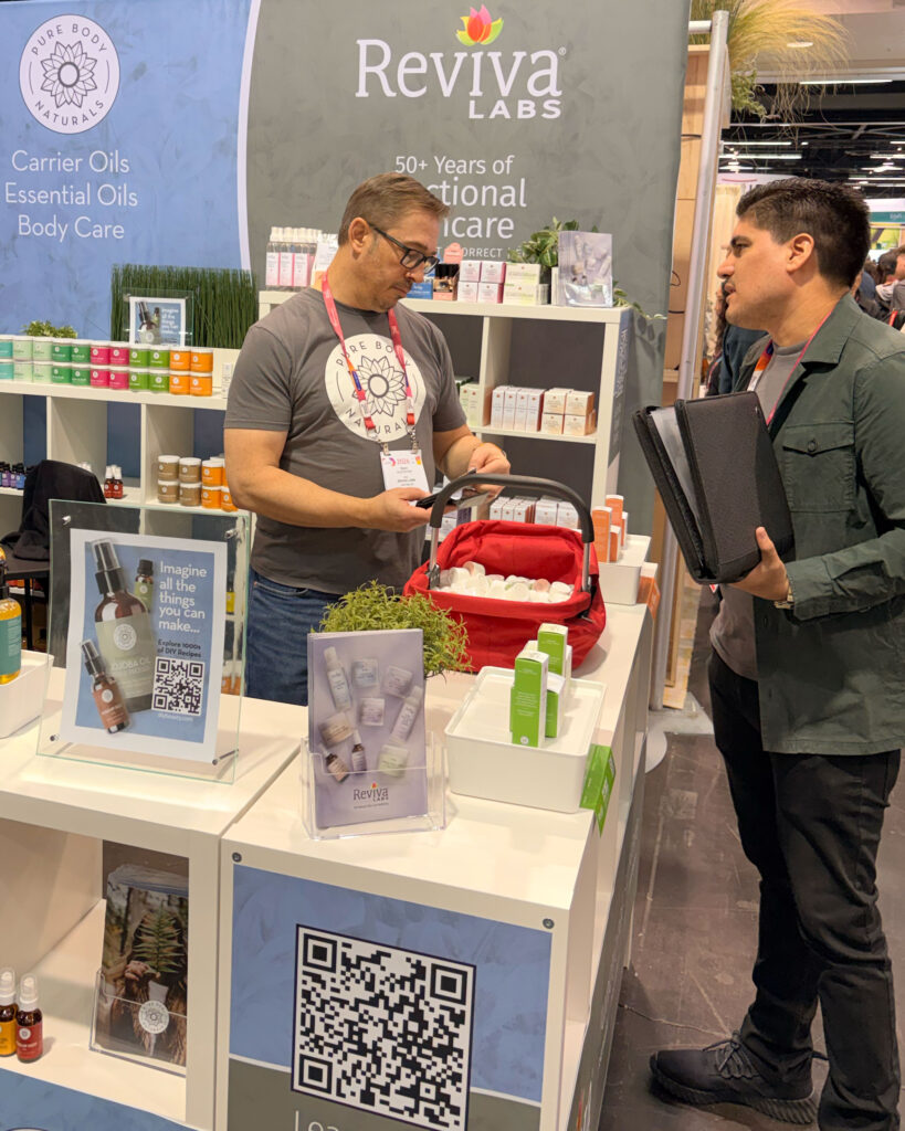 Two people at skincare product booth