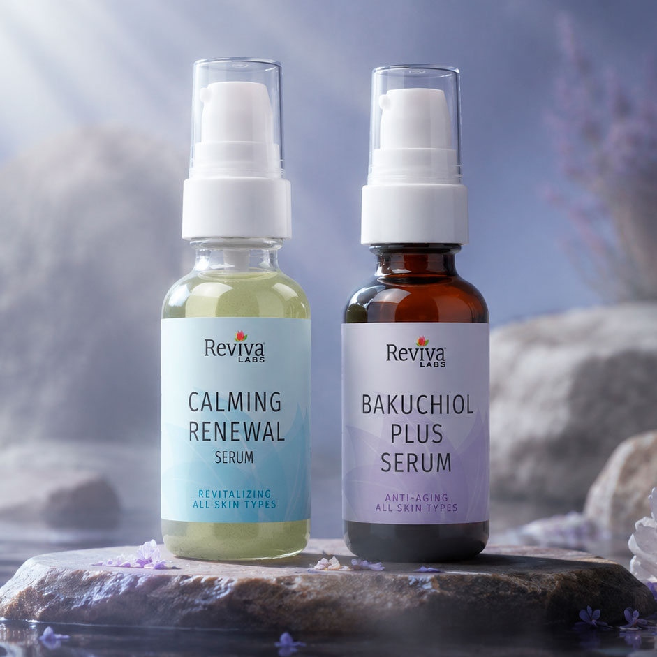 Two Reviva Labs facial serum bottles on stone