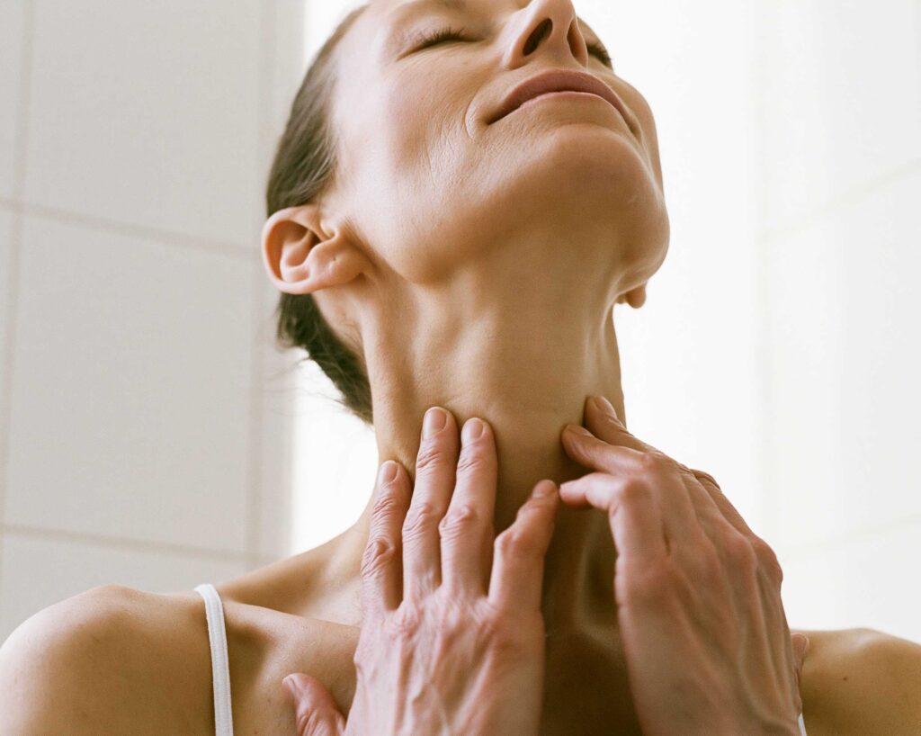 Woman receiving neck massage therapy session