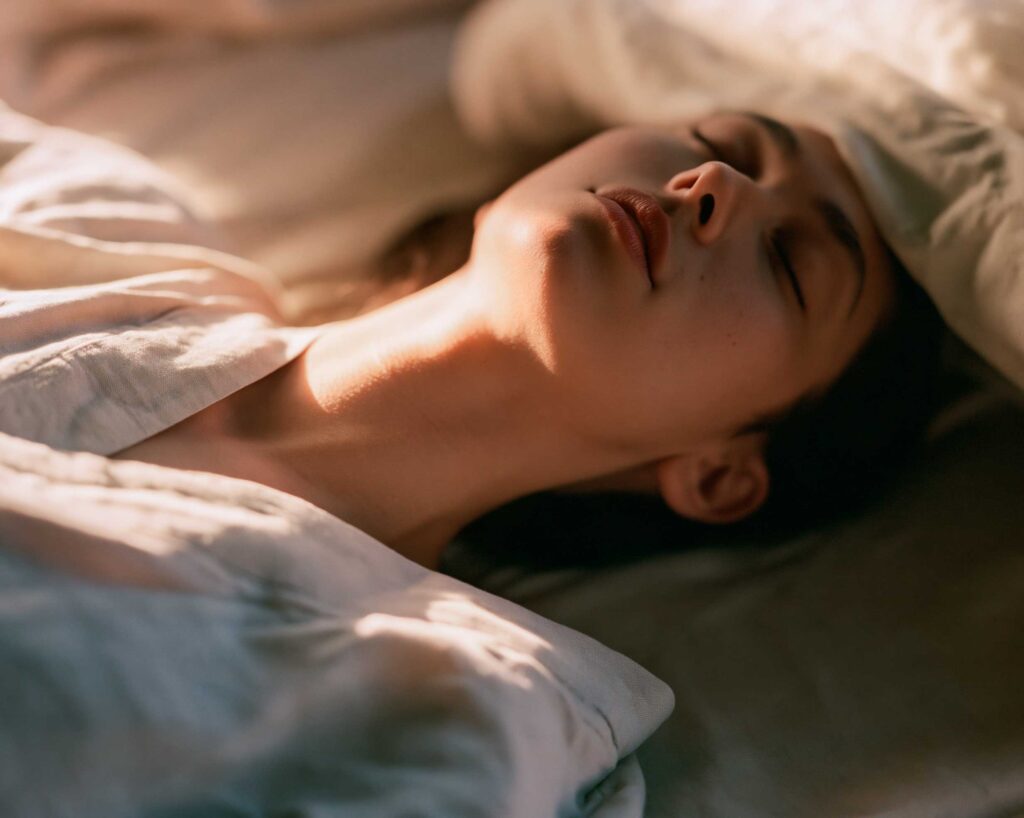 Person sleeping peacefully in warm morning light