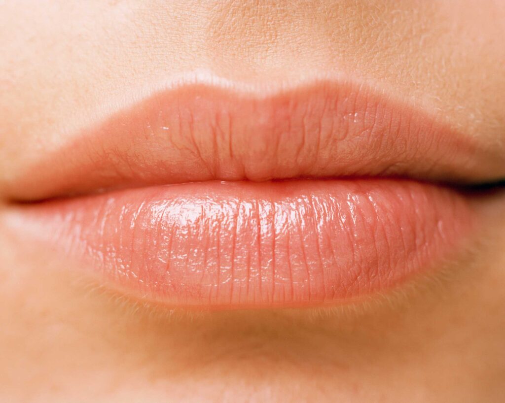 Close-up of natural pink human lips