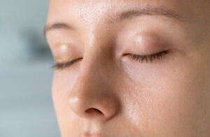 Close-up of person's face with closed eyes