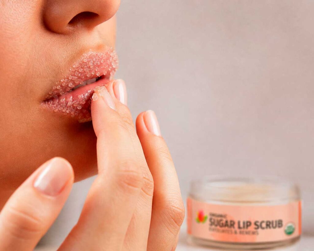 Close-up of sugar lip scrub application