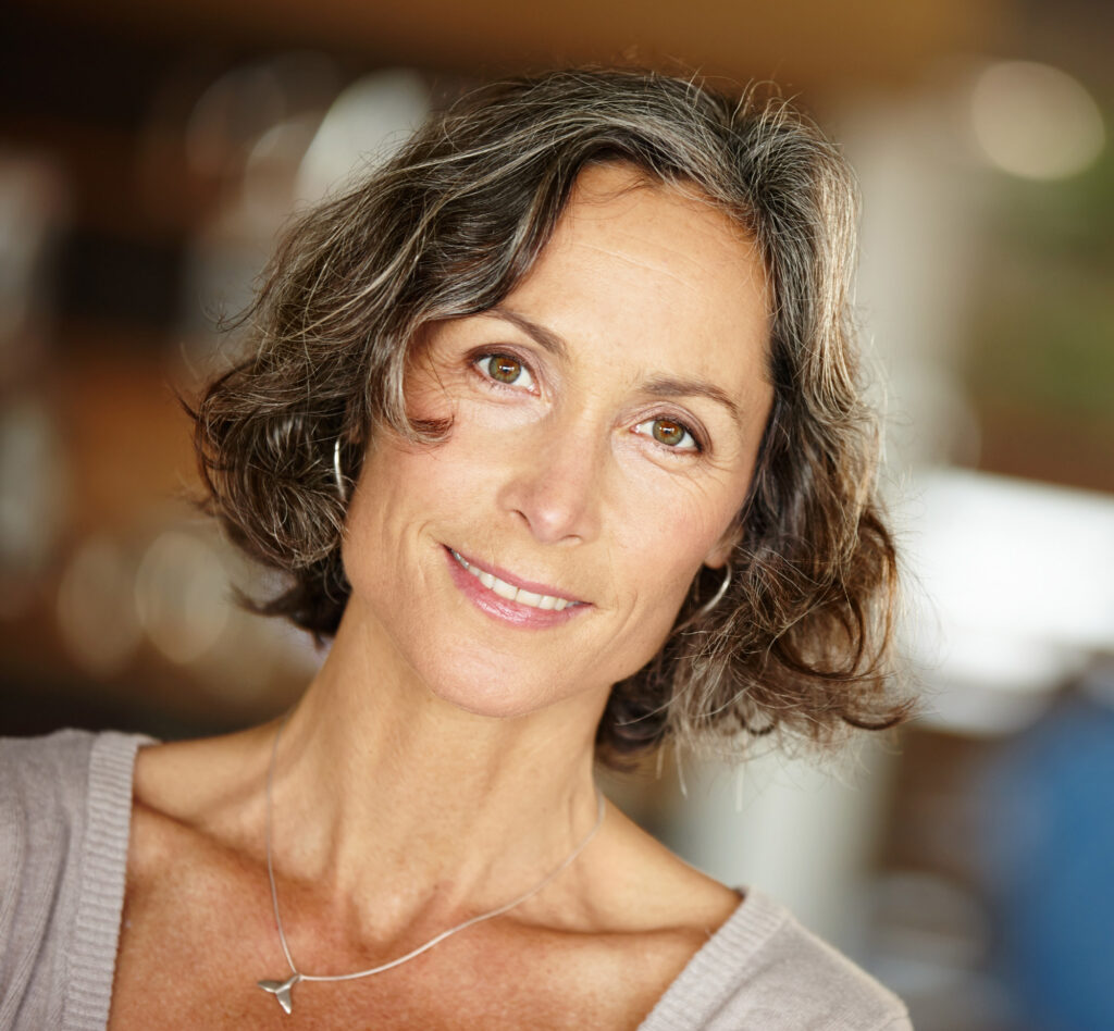 Smiling middle-aged woman with short wavy hair