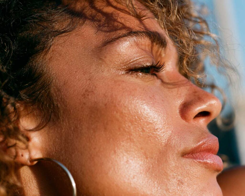 Close-up profile of woman in warm sunlight