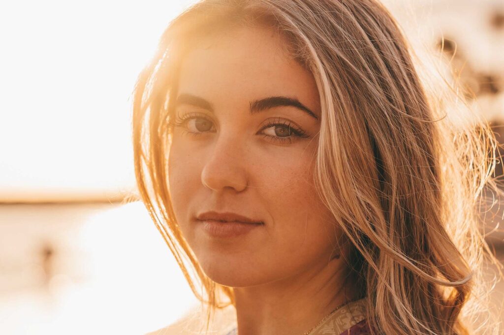 Close-up portrait of woman in golden sunset light