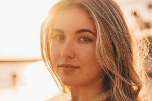 Close-up portrait of woman in golden sunset light