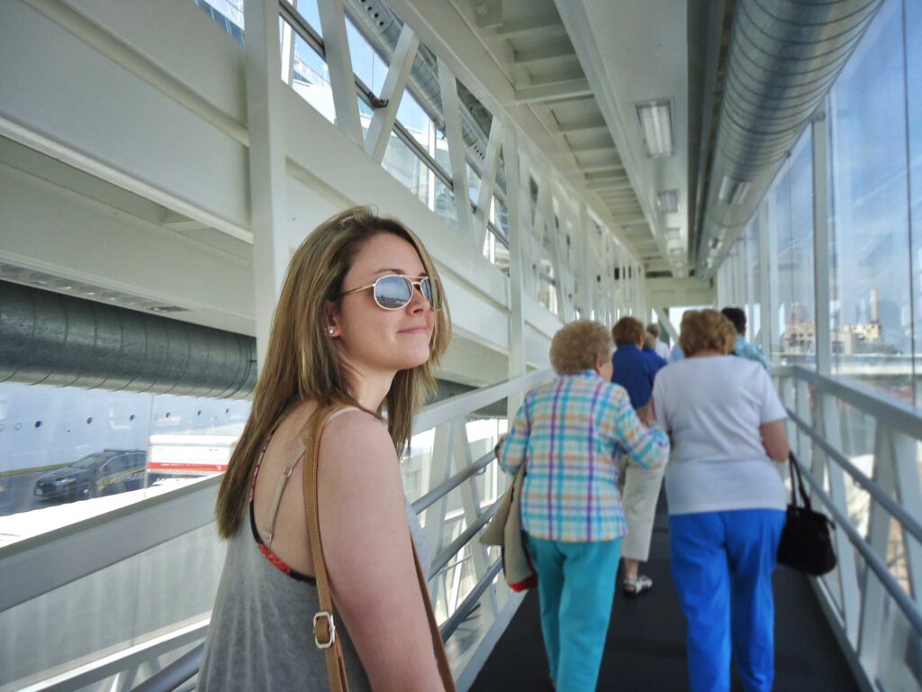 woman walking in modern urban cruise terminal 2026 01 08 22 54 35 utc