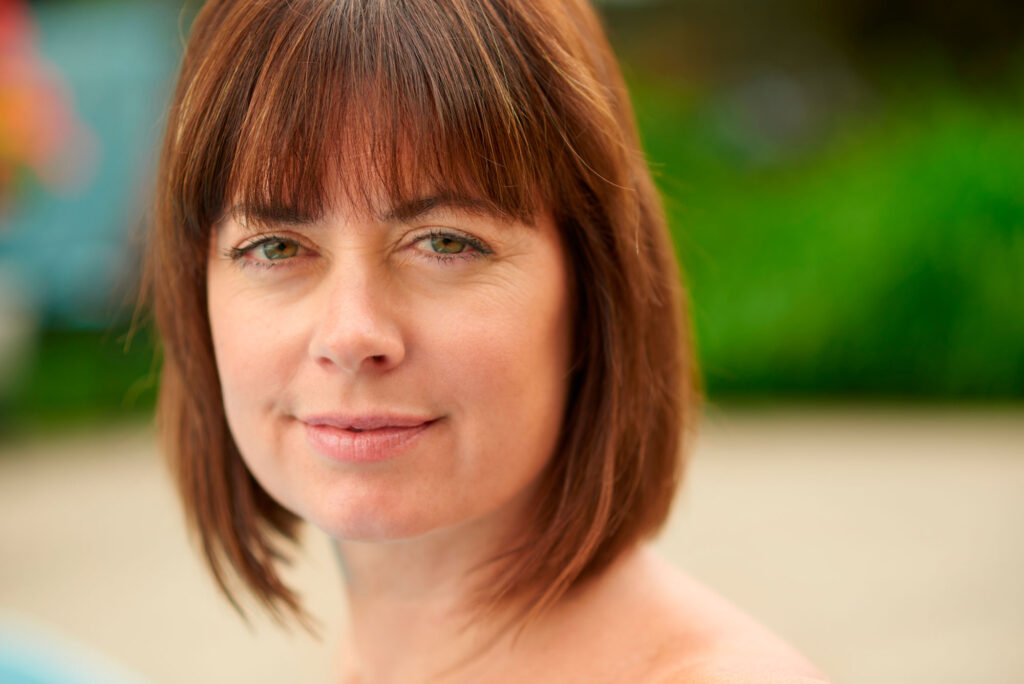 woman with brown hair close up smiling 2026 03 26 08 09 32 utc