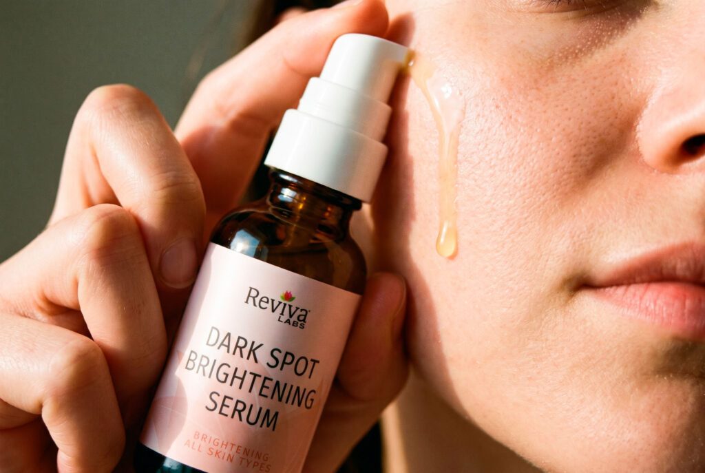 Applying dark spot brightening serum to cheek