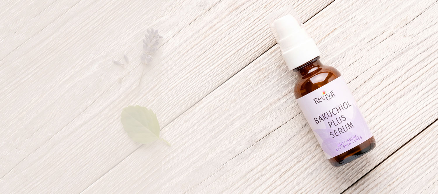 Revia Labs Bakuchiol Plus Serum bottle on wooden surface