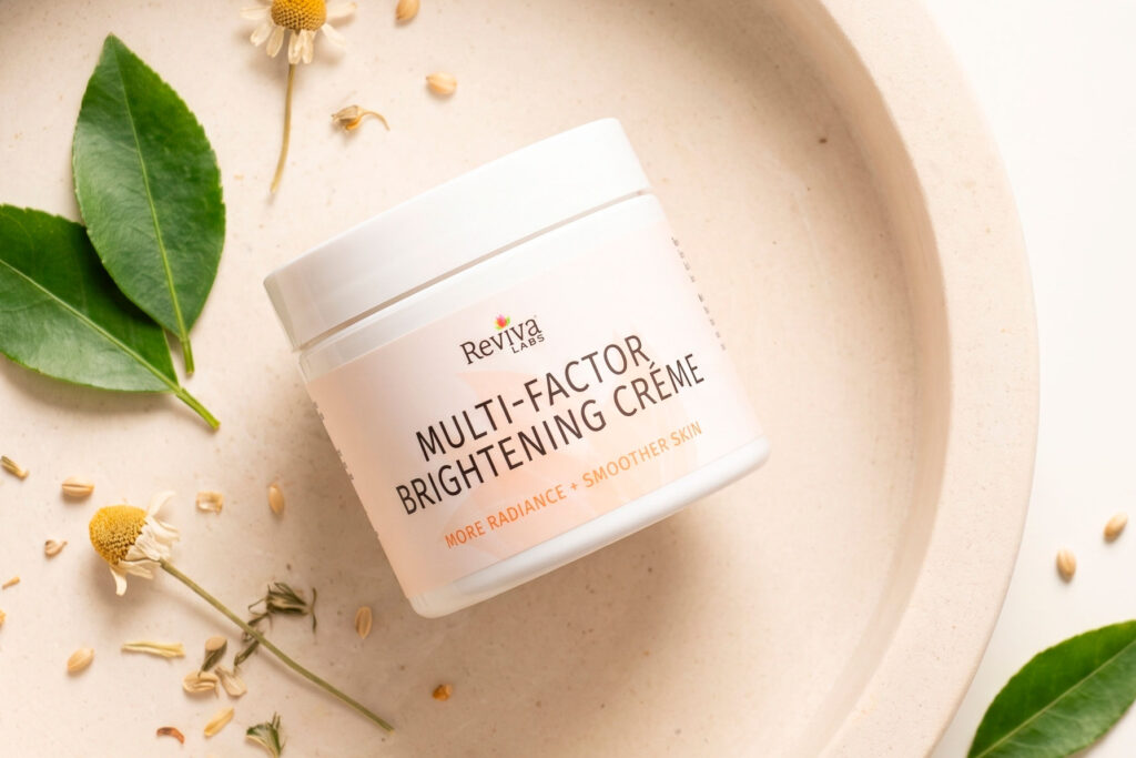 Reviva Labs brightening cream jar with leaves and flowers