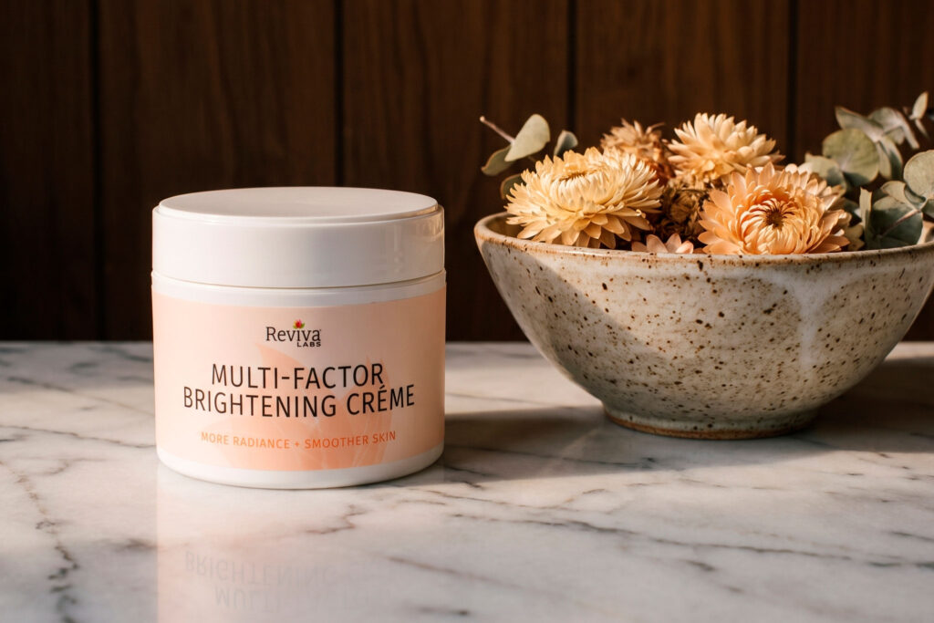 Reviva Labs brightening cream beside dried flowers