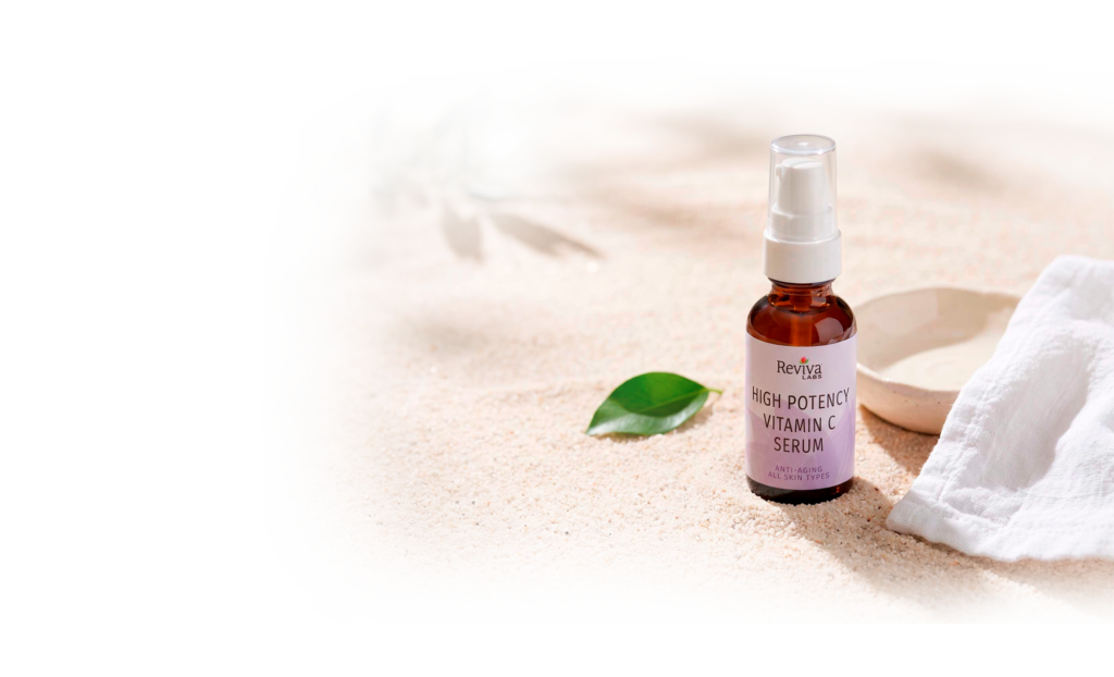 Reviva Labs vitamin C serum bottle on sand