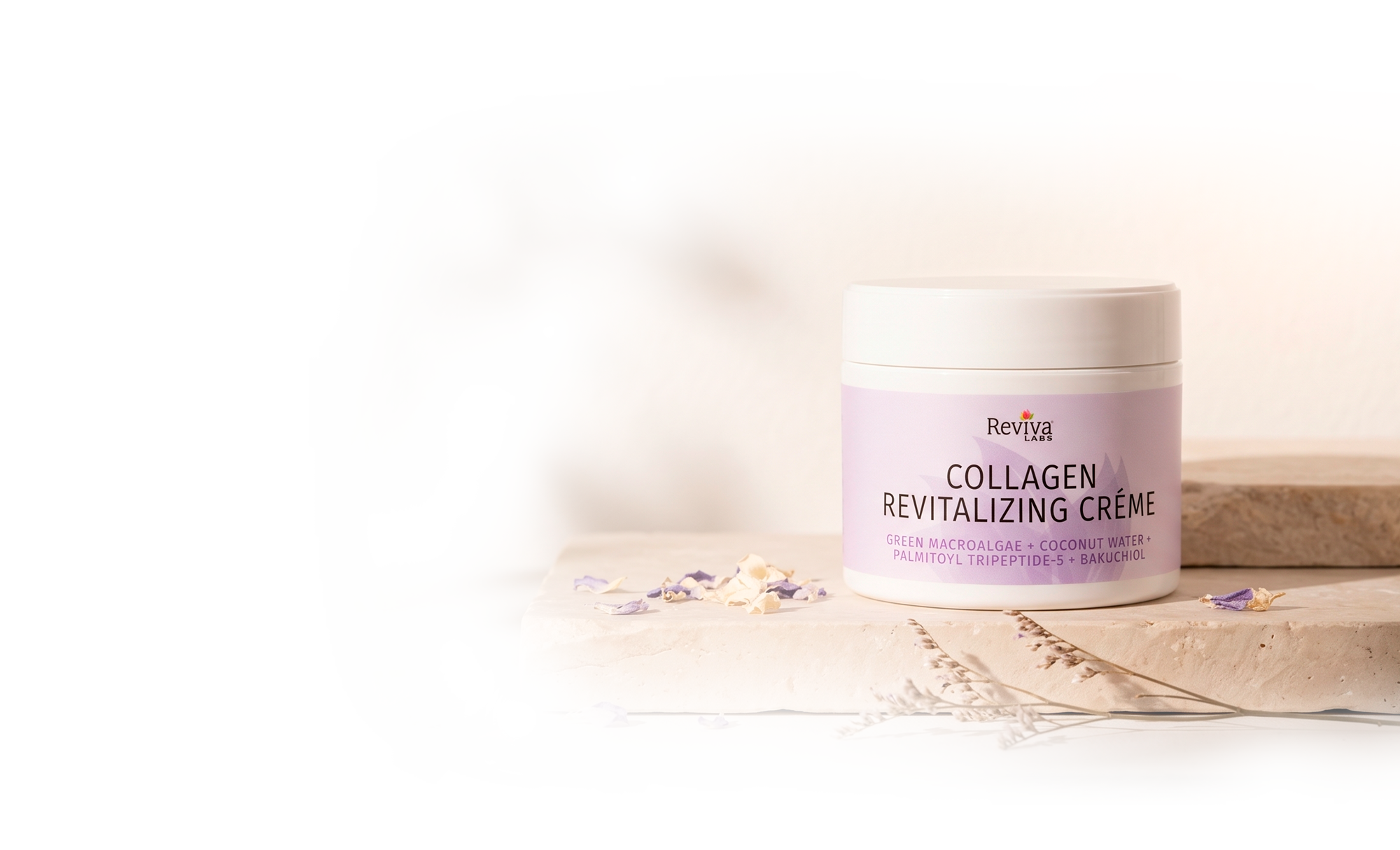 Reviva Labs Collagen Revitalizing Crème jar on stone pedestal