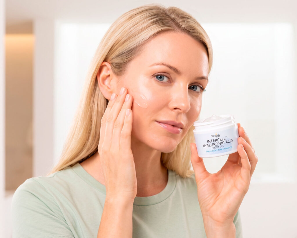 Woman applies hyaluronic acid gel while holding product jar.