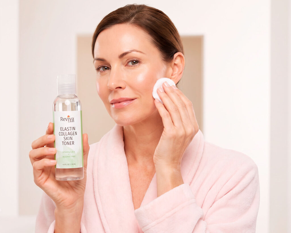 Woman applies Reviva Labs elastin collagen skin toner