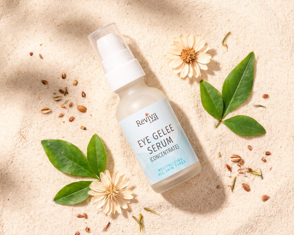 Reviva Labs Eye Gelee Serum on sand with flowers